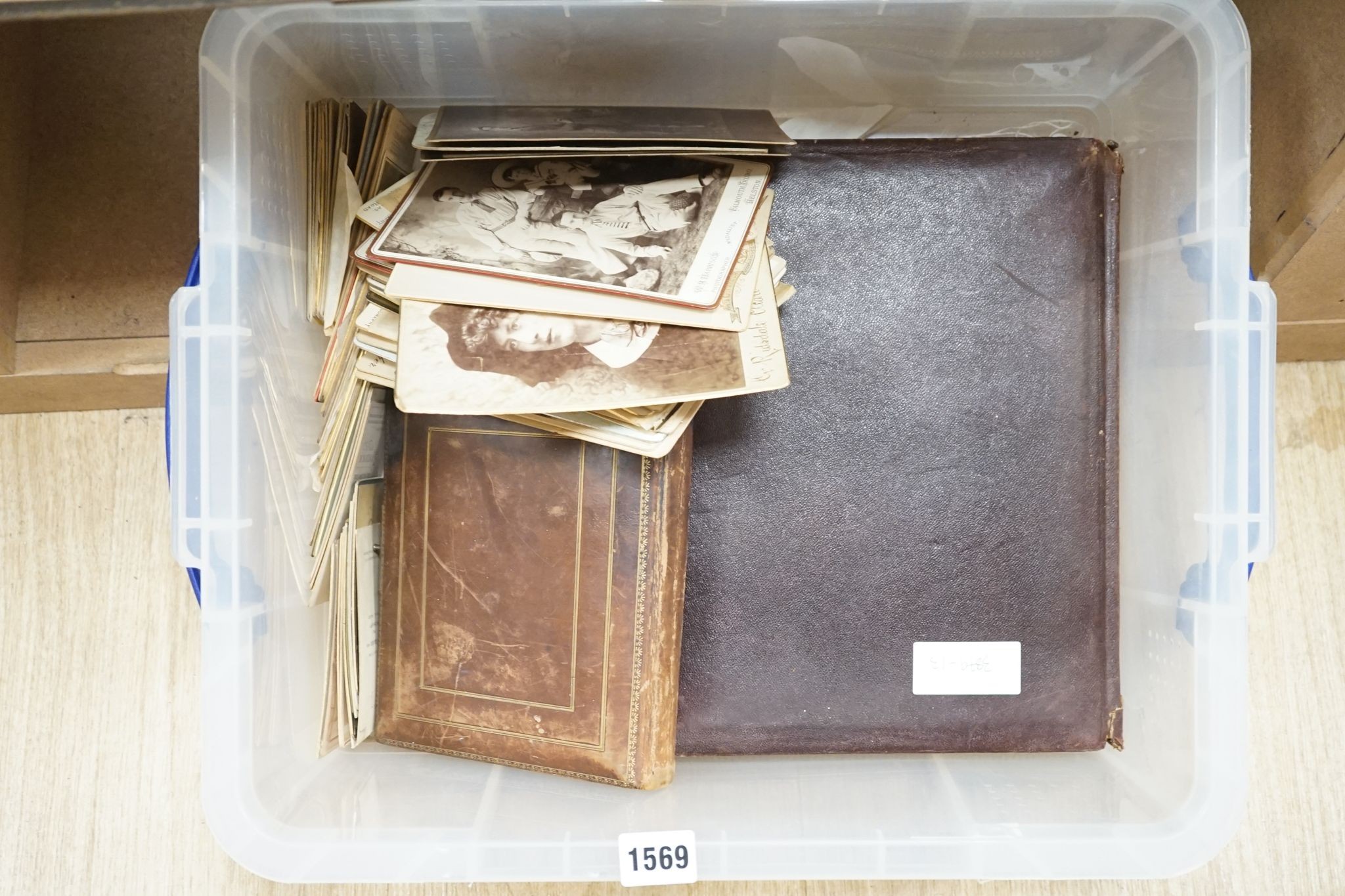 Two Victorian albums and a quantity of loose photographs